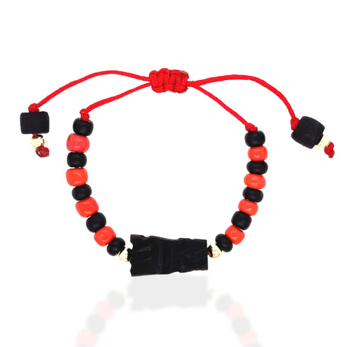 Introducing the Genuine Azabache Fist Red Rope Evil Eye Bracelet for Adult Protection, a handmade piece featuring alternating black and red beads on a vibrant red string. At its heart lies a central black bead with an intricate carved design, offering spiritual shielding. The adjustable cords are adorned with smaller beads at the ends to enhance its protective qualities against the Evil Eye in a stylish manner.